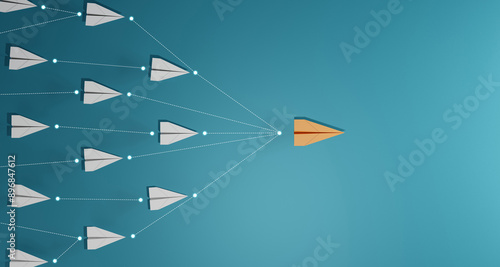 Leadership concept, Orage leader plane leading white plane, on blue background.