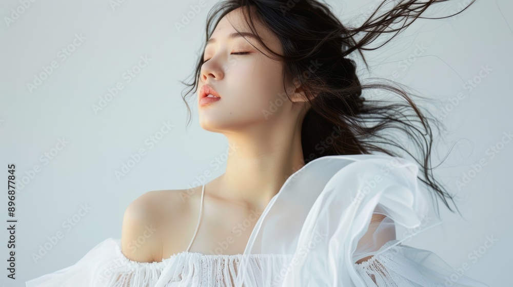 Beautiful asian woman model wearing a whte dress on an empty background, suitable for beauty advertising, skin care ads Beautiful asian woman model wearing a whte dress on an empty background, suitable for beauty advertising, skin care ads