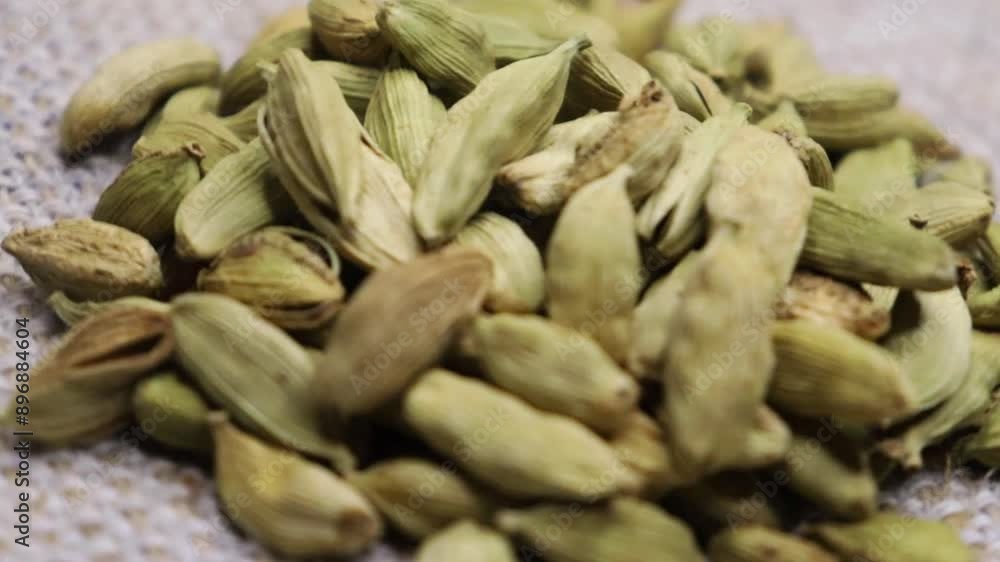 Green Cardamom Cardamon Rotate slow motion close up 4k video. Circle Around Background. Green Cardamom Cardamon Rotate slow motion close up 4k video. Circle Around Background.