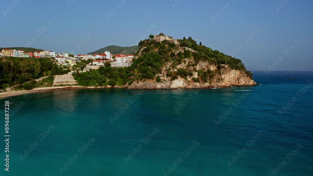Aerial view of Parga in the Epirus region in Greece. Drone view of the picturesque colorful coastal town, high view of the beaches and vibrant turquoise water. View of the castle on the hill. Aerial view of Parga in the Epirus region in Greece. Drone view of the picturesque colorful coastal town, high view of the beaches and vibrant turquoise water. View of the castle on the hill.