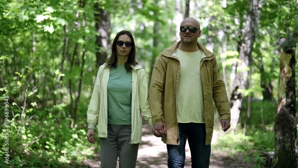 A walk through the park of a couple in love, they open up to each other the most important moments of life, their conversations are full of tenderness, and each step strengthens their feelings. A walk through the park of a couple in love, they open up to each other the most important moments of life, their conversations are full of tenderness, and each step strengthens their feelings.