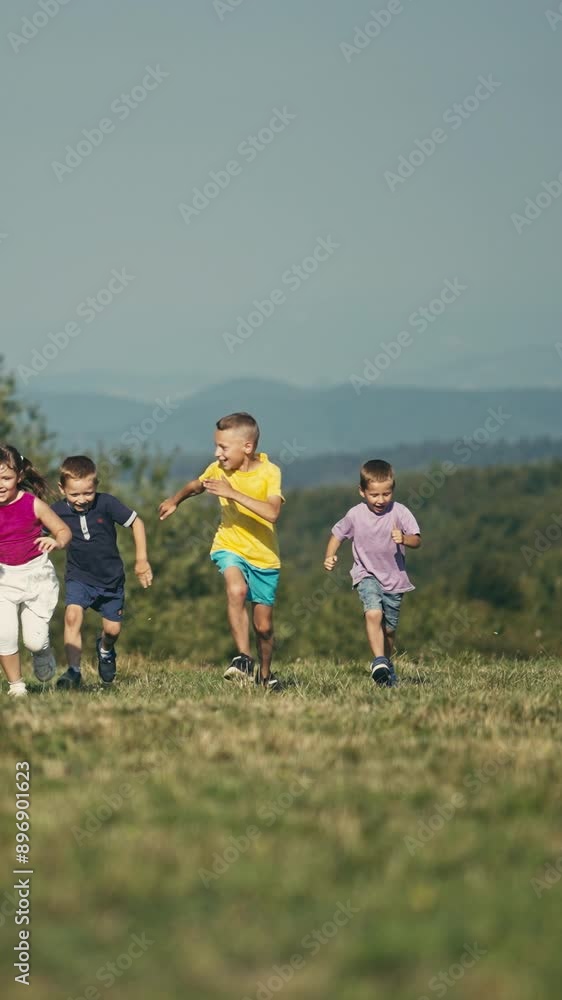 Vertical Screen: Four children run across a sunny meadow toward the camera, embodying the excitement and freedom of active outdoor play. The scene captures the energetic essence of the childhood