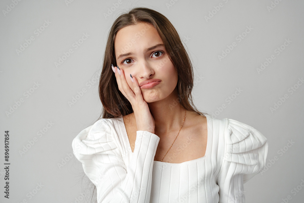 Young Woman Posing iAgainst a White Background Young Woman Posing iAgainst a White Background