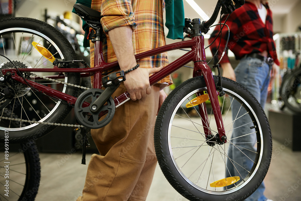 Man buying new bicycle for their child Man buying new bicycle for their child