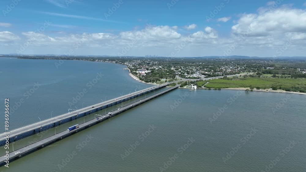 Drone shot of Ted Smout Memorial Bridge, camera flying forwards with Bridge, Moreton Bay, Ocean and Brisbane City in background. Drone shot of Ted Smout Memorial Bridge, camera flying forwards with Bridge, Moreton Bay, Ocean and Brisbane City in background.