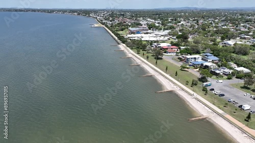 Wallpaper Mural Drone establishing pull away shot of Brisbane Brighton Suburb, camera flying over water Moreton Bay with Brisbane City in background. Brighton Beach Foreshore and Decker Park in shot. Push in Pan Up Torontodigital.ca