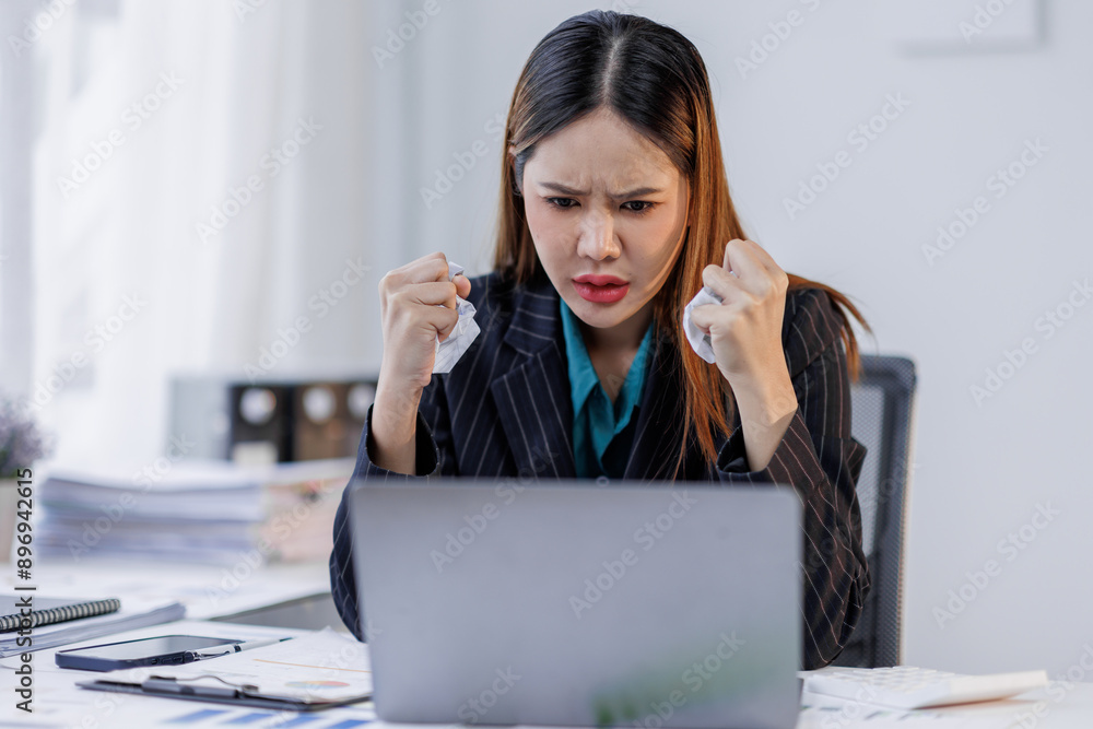 Portrait of tired business asian woman sitting at a work. documents tax laptop computer in office. Sad, unhappy, Worried, Depression, or overworked, failure employee life stress concept Portrait of tired business asian woman sitting at a work. documents tax laptop computer in office. Sad, unhappy, Worried, Depression, or overworked, failure employee life stress concept