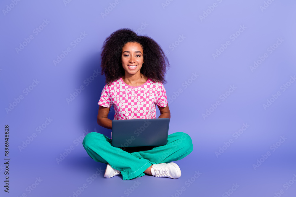 Photo of cheerful nice lovely woman wear trendy clothes sit floor isolated on purple color background Photo of cheerful nice lovely woman wear trendy clothes sit floor isolated on purple color background