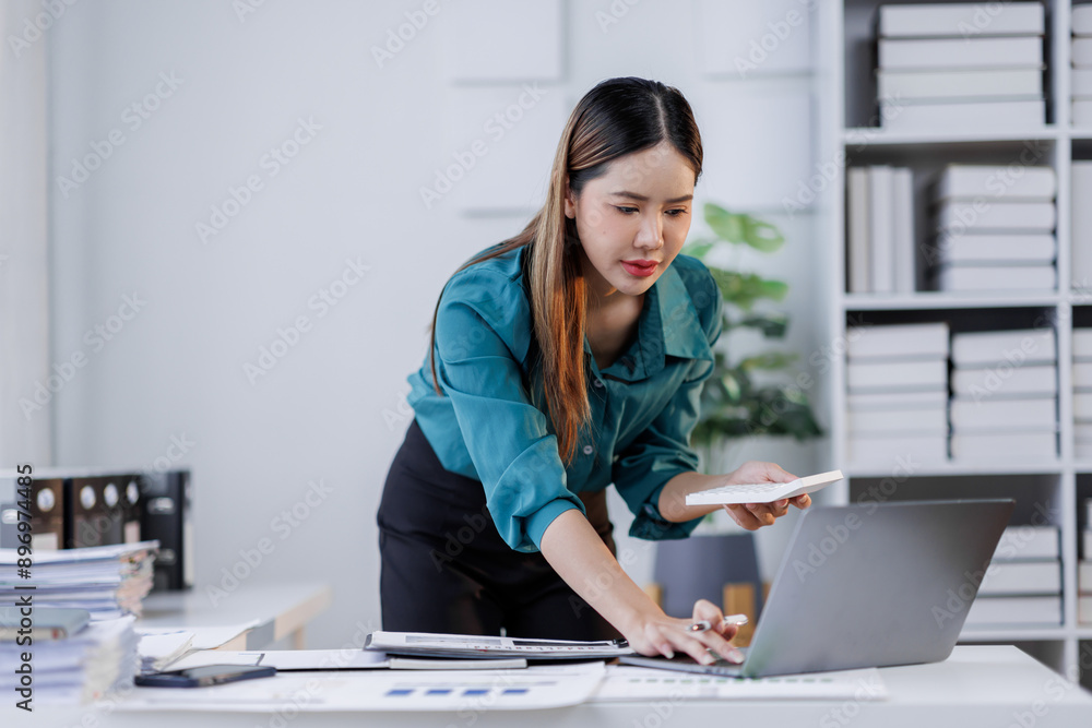 Business, finance and accounting concept. Business asian woman using calculator to calculate financial report, data analysis, graph growth chart, business planning, strategy and investment Business, finance and accounting concept. Business asian woman using calculator to calculate financial report, data analysis, graph growth chart, business planning, strategy and investment