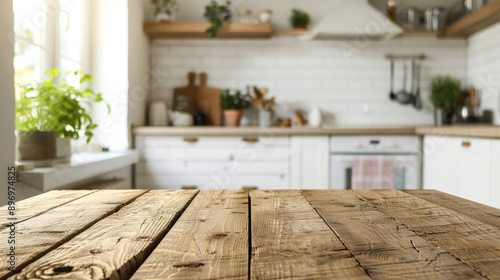 A wooden table sits empty in a brightly lit kitchen. The background is a blur of white light.