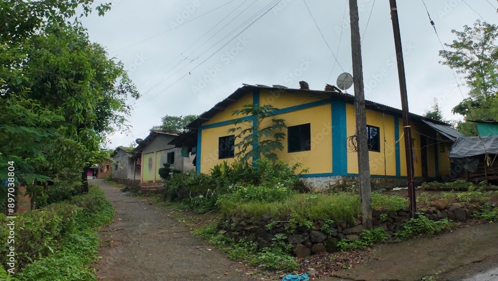 A rural village in Maharashtra with houses under a cloudy sky during the monsoon season, showcasing the serene landscape.
A rural village in Maharashtra with houses under a cloudy sky during the monsoon season, showcasing the serene landscape.