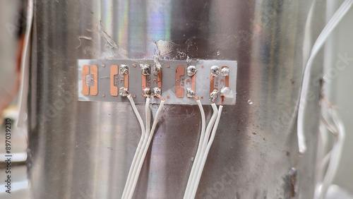Photography Extensometry gauges, strain gauges glued on a metal sample.