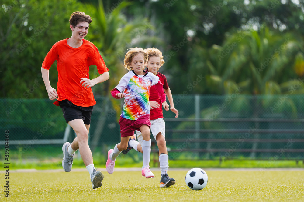Child playing football. Kids play soccer. Child playing football. Kids play soccer.