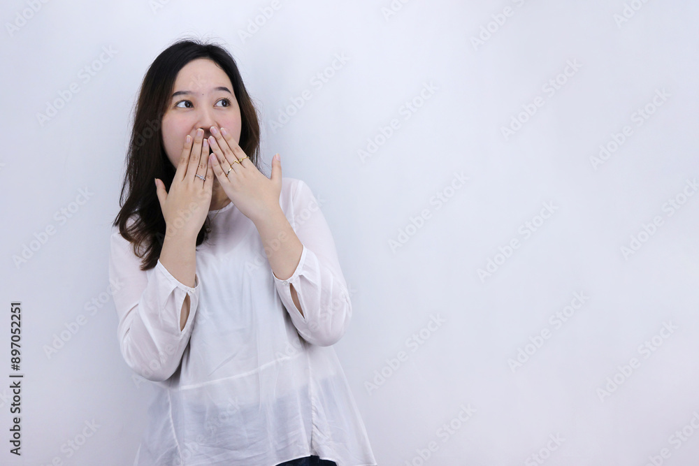 Young Asian woman surprised looking to empty space Young Asian woman surprised looking to empty space