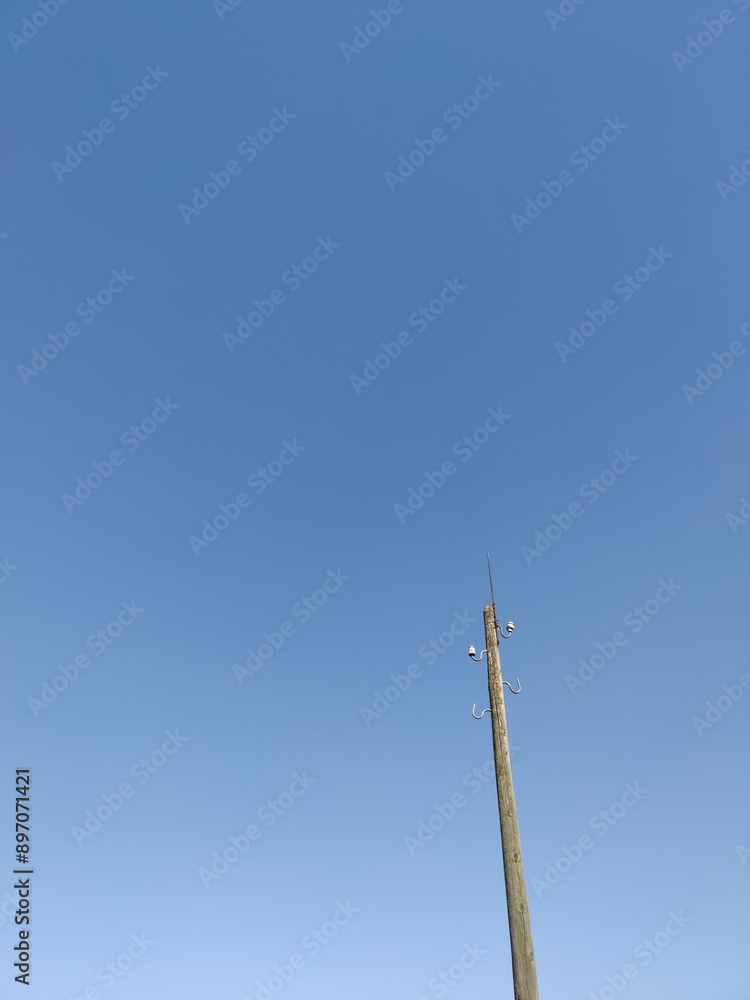 an old wooden lamppost on a blue background, minimalism an old wooden lamppost on a blue background, minimalism