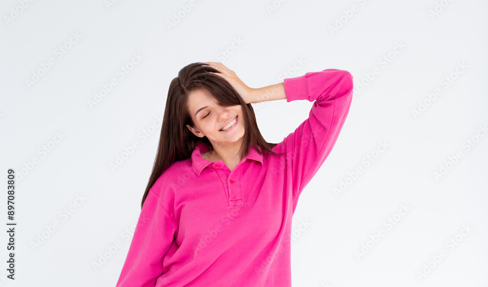 Laughing woman in pink long sleeve with ginger hair over white wall. Toothy smile. Laughing woman in pink long sleeve with ginger hair over white wall. Toothy smile.