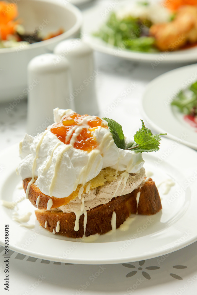 Cake with whipped vanilla cream served with apricot jam Cake with whipped vanilla cream served with apricot jam