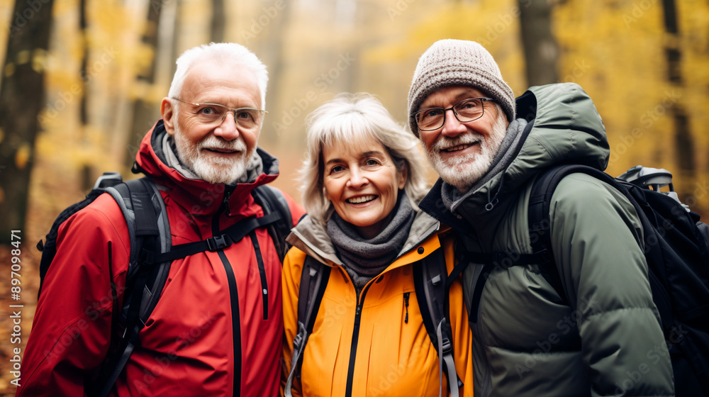 senior people group hiking in the forest in autumn, portrait looking at camera, photography. senior people group hiking in the forest in autumn, portrait looking at camera, photography.