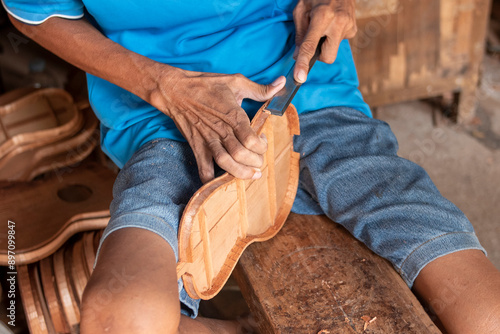 Fotografie Ukulele being made by hand by a craftsman
