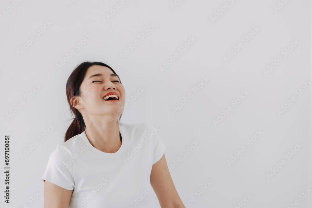 Happy asian Thai woman laughing, closing eyes, amuse of funny story, standing isolated over white background wall. Happy asian Thai woman laughing, closing eyes, amuse of funny story, standing isolated over white background wall.