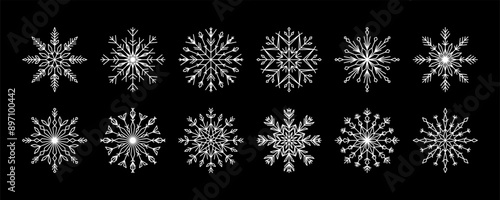 Set of white snowflakes on black background. Snowflake winter design, decor. Winter geometric decorative elements of white cold flakes crystal, snow ornament for New Year's holidays, frostwork icons