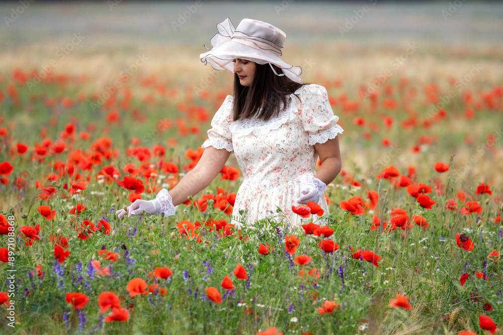Young girl in retro style with white gloves and retro hat picking flowers Young girl in retro style with white gloves and retro hat picking flowers