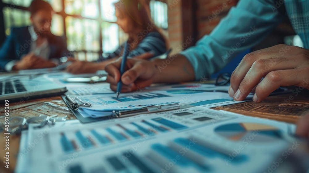 Fototapeta premium A team of accountants working on financial statements, showcasing precision in accounting
