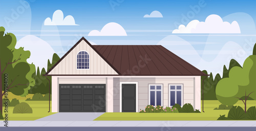 House in suburb at Summer, residential cottage, real estate countryside building exterior. Home facade with garage, garden, trees, shrubs, driveway, green lawn in front yard and blue sky background. 
