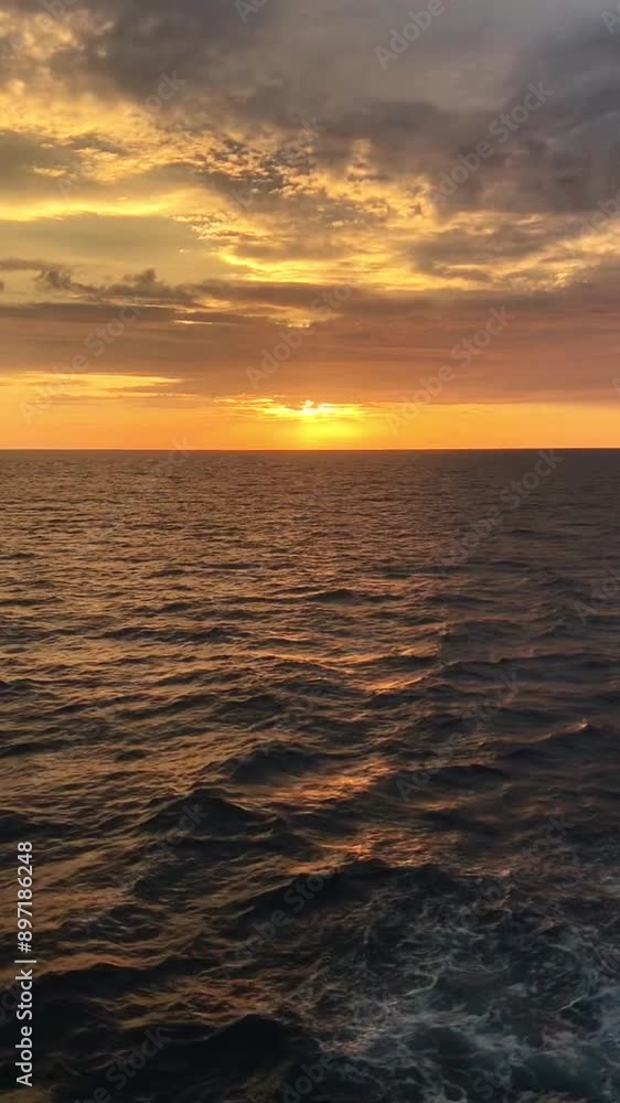 Aerial view of sunset horizon over the sea. Sun path is reflected in sea surface. Nature beauty. Vertical video Aerial view of sunset horizon over the sea. Sun path is reflected in sea surface. Nature beauty. Vertical video