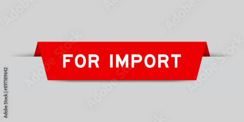 Red color inserted label with word for import on gray background