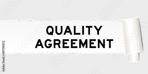 Ripped gray paper background that have word quality agreement under torn part