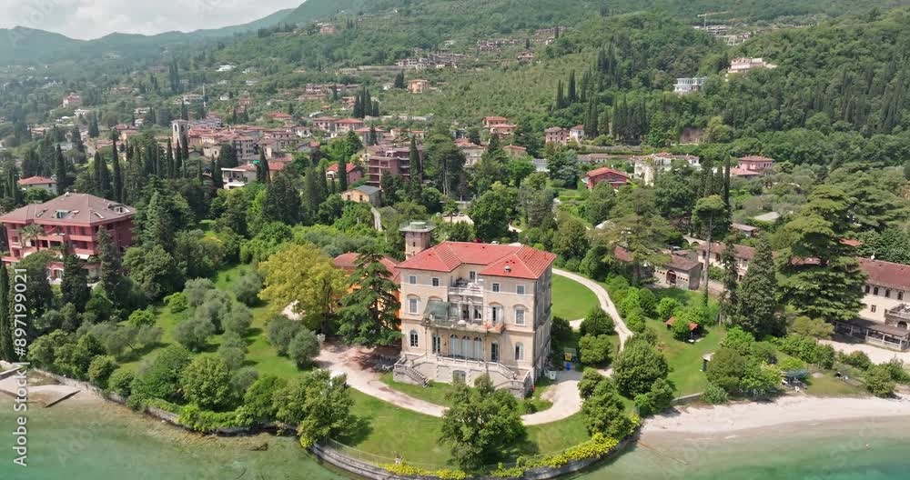 Aerial view cityscape of Toscolano Maderno on Lake Garda in Italy. Beautiful architecture of the city with the embankment in the Dolomite Alps. High quality 4k footage Aerial view cityscape of Toscolano Maderno on Lake Garda in Italy. Beautiful architecture of the city with the embankment in the Dolomite Alps. High quality 4k footage