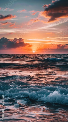 Ocean waves crest under a vibrant sunset sky