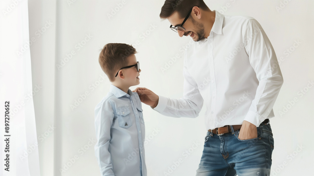Fototapeta premium A happy father and son getting dressed for work and school, their looks reflect love and friendship.
