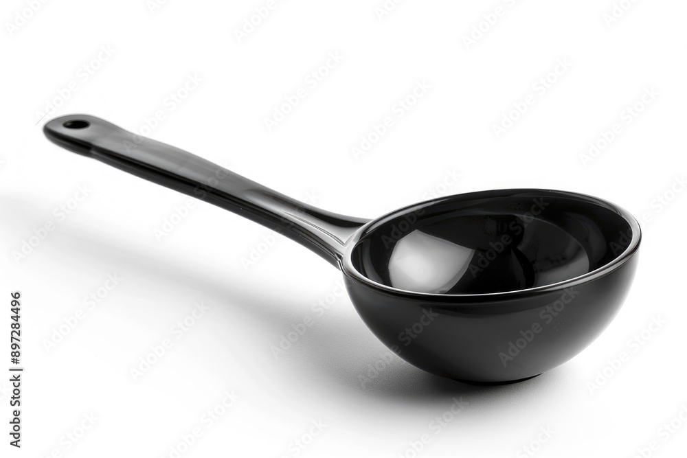 Black plastic soup ladle on a white background. Black plastic soup ladle on a white background.