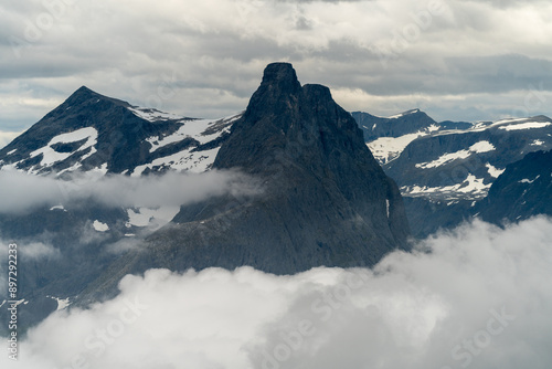 Romsdalseggen Ridge mountain peak  trail in Andalsnes Romsdal Norway with clouds and fog on a summer day photo