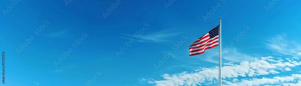 Fototapeta premium Proudly Waving, Majestic American Flag on Pole.