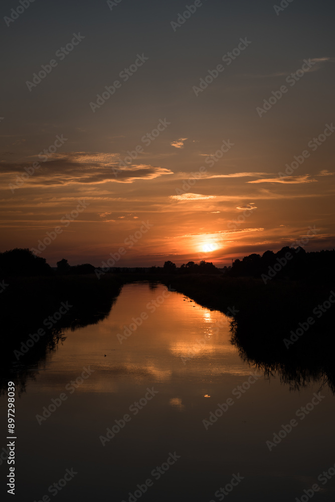 Obraz premium SUNSET - Evening landscape by the river