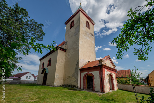 Church of St. Wenceslas - Hrusice (Czech Republic) - The originally Romanesque church was later rebuilt in Baroque style, but the remarkable Romanesque portal has been preserved. photo