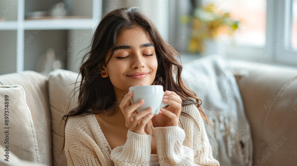 Young woman enjoying morning coffee in a cozy setting Young woman enjoying morning coffee in a cozy setting