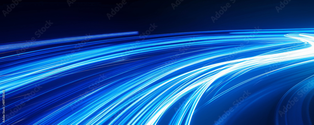 Blue light trails on a dark background Blue light trails on a dark background