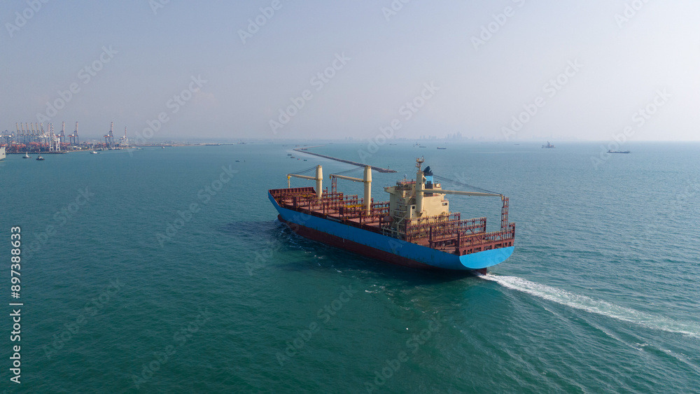 Obraz premium container,container ship in import export and business logistic,By crane,Trade Port , Shipping,cargo to harbor.Aerial view,Water transport,International,Shell Marine,transportation,logistic,trade,port