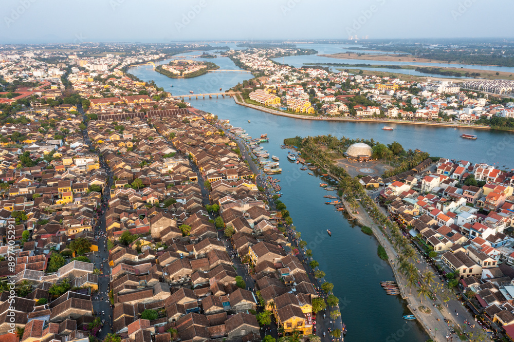 Fototapeta premium Aerial drone view of Hoi An city, Vietnam. Ancient town, UNESCO world heritage, at Quang Nam province.