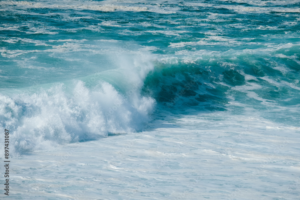 Fototapeta premium A close-up of a powerful ocean wave breaking, highlighting the raw force and beauty of the sea in motion.