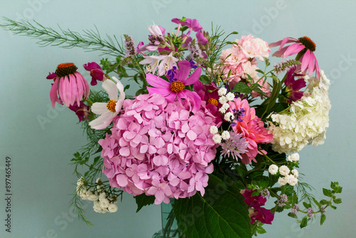 Obraz na płótnie A bouquet of summer flowers in the room. Hydrangea, rose, echinacea, mint, snapdragon, asparagus and other flowers. w salonie