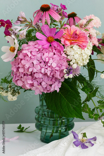 Obraz na płótnie A bouquet of summer flowers in the room. Hydrangea, rose, echinacea, mint, snapdragon, asparagus and other flowers. w salonie