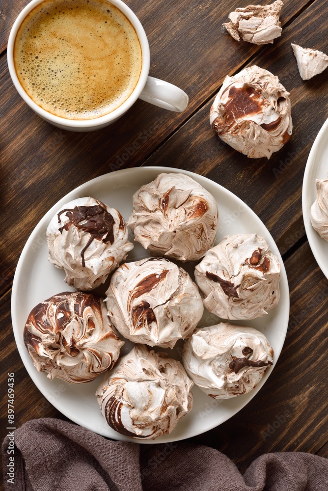 Chocolate meringue cookies and cup of coffee Chocolate meringue cookies and cup of coffee