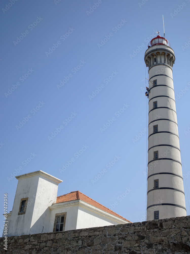 Lighthouse maintenance by professional climbers Lighthouse maintenance by professional climbers
