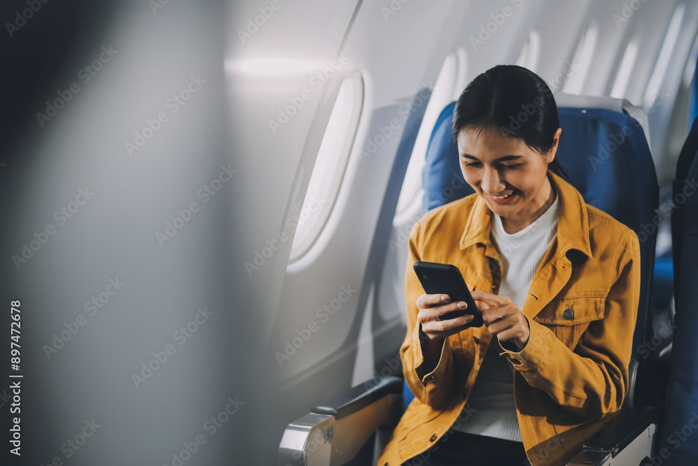 Texting on mobile chat app, Thoughtful asian people female person onboard, airplane window, perfectly capture the anticipation and excitement of holiday travel. chinese, japanese people. Texting on mobile chat app, Thoughtful asian people female person onboard, airplane window, perfectly capture the anticipation and excitement of holiday travel. chinese, japanese people.