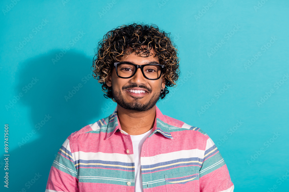 Photo of cheerful glad man wear stylish striped clothes eyewear isolated on cyan color background Photo of cheerful glad man wear stylish striped clothes eyewear isolated on cyan color background